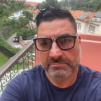 Diverse film crew with clapperboard in café setting filming scene.